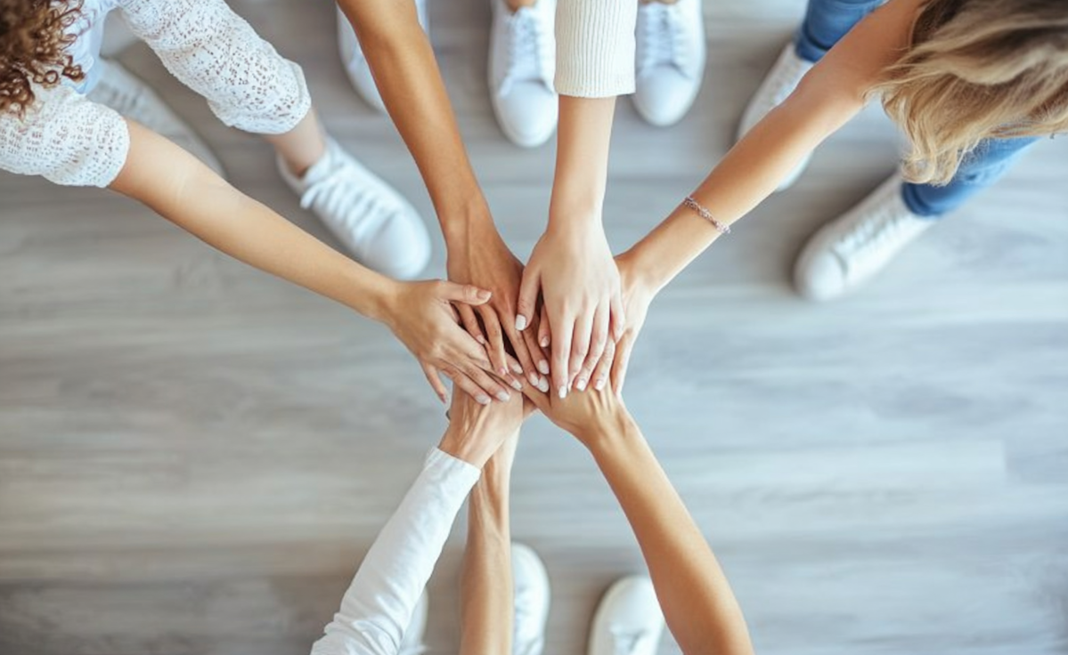 Foto - Tým spojuje ruce